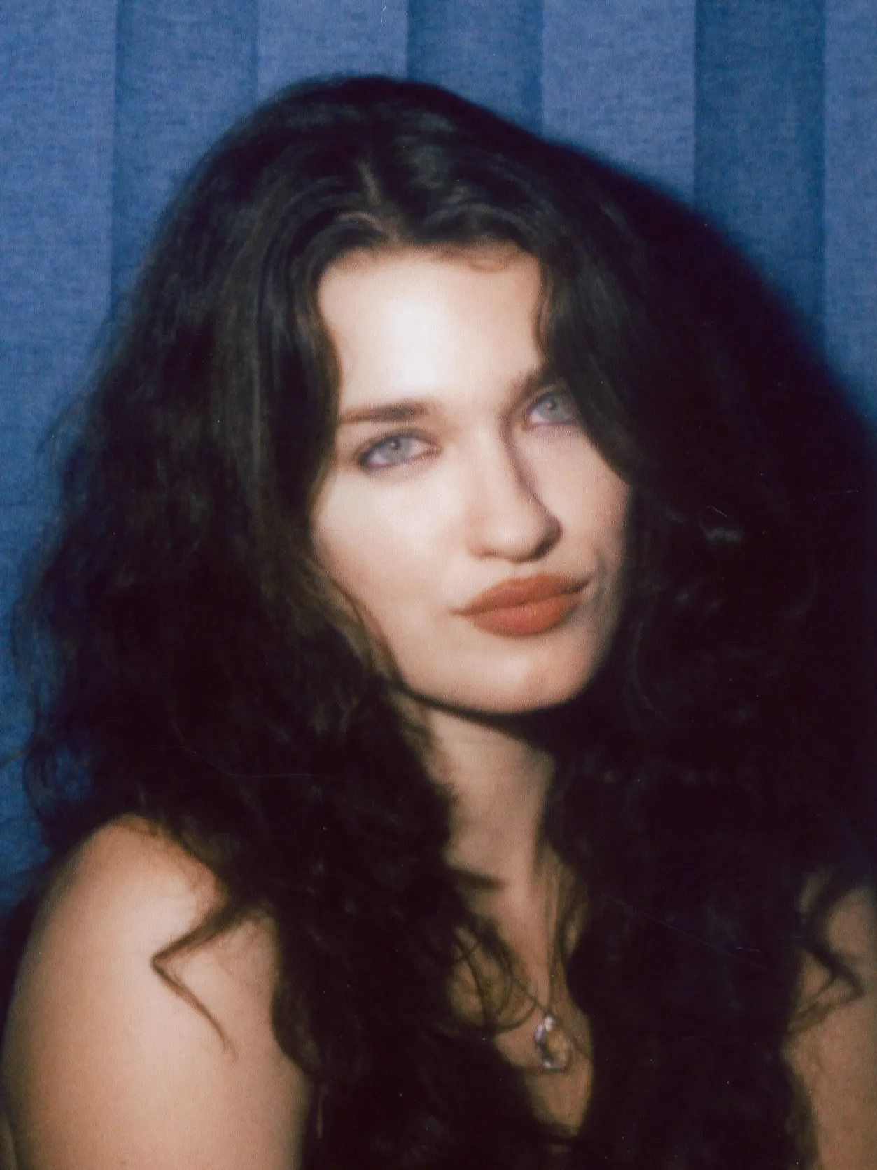 Enclosed photo booth color strip, frame two: a head tilt and a knowing look