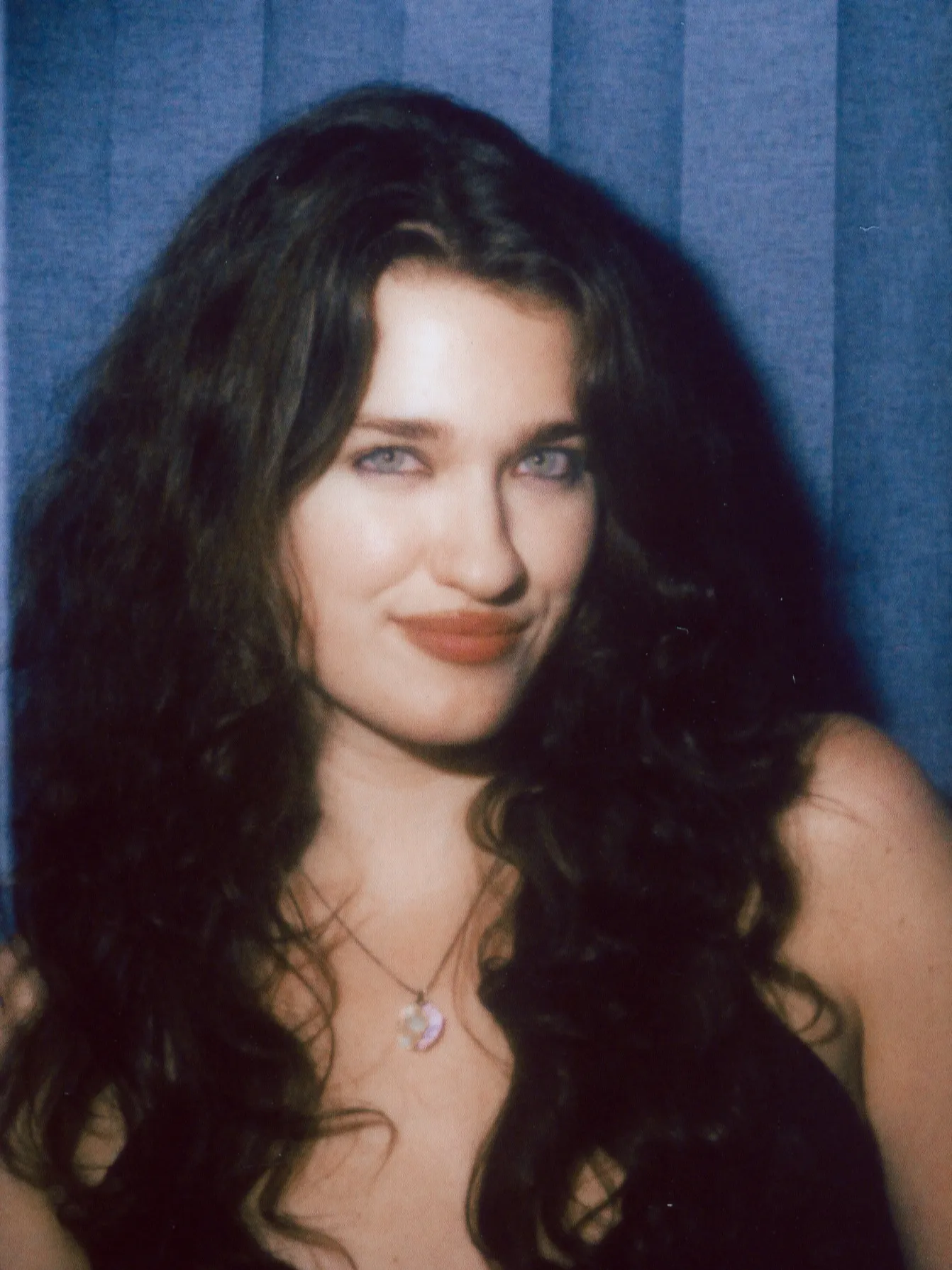Enclosed photo booth color strip, frame three: a soft smile